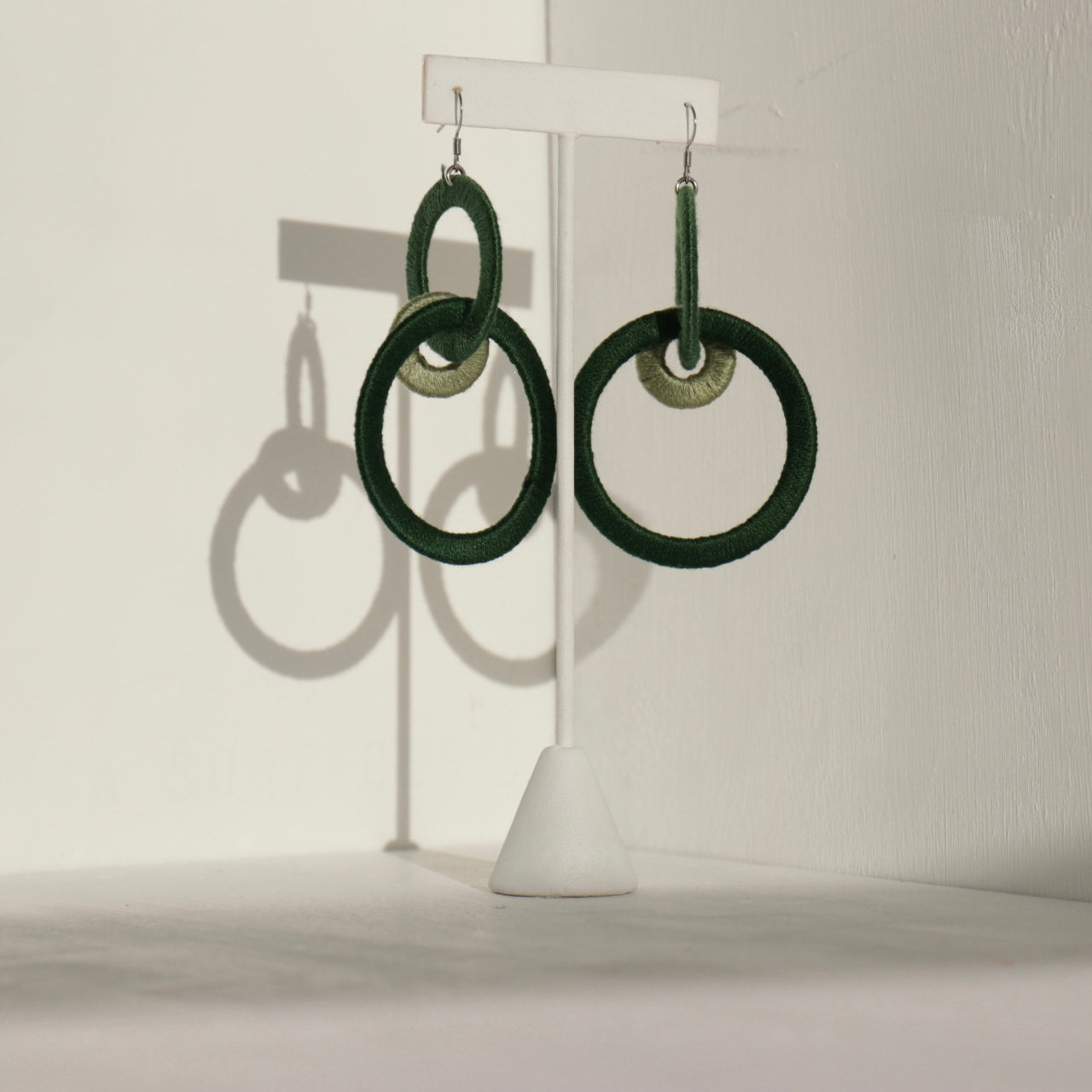 Close-up of the Jodee Statement Earrings, featuring interlocking loops that move with intention. A handcrafted piece designed in Houston for effortless expression.
