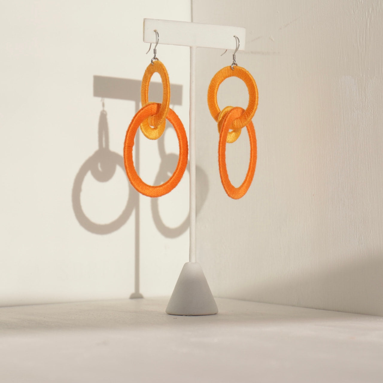 Close-up of the Jodee Statement Earrings, featuring interlocking loops that move with intention. A handcrafted piece designed in Houston for effortless expression.