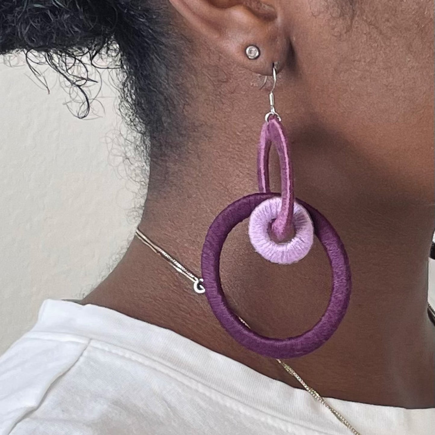 Close-up of the Jodee Statement Earrings, featuring interlocking loops that move with intention. A handcrafted piece designed in Houston for effortless expression.