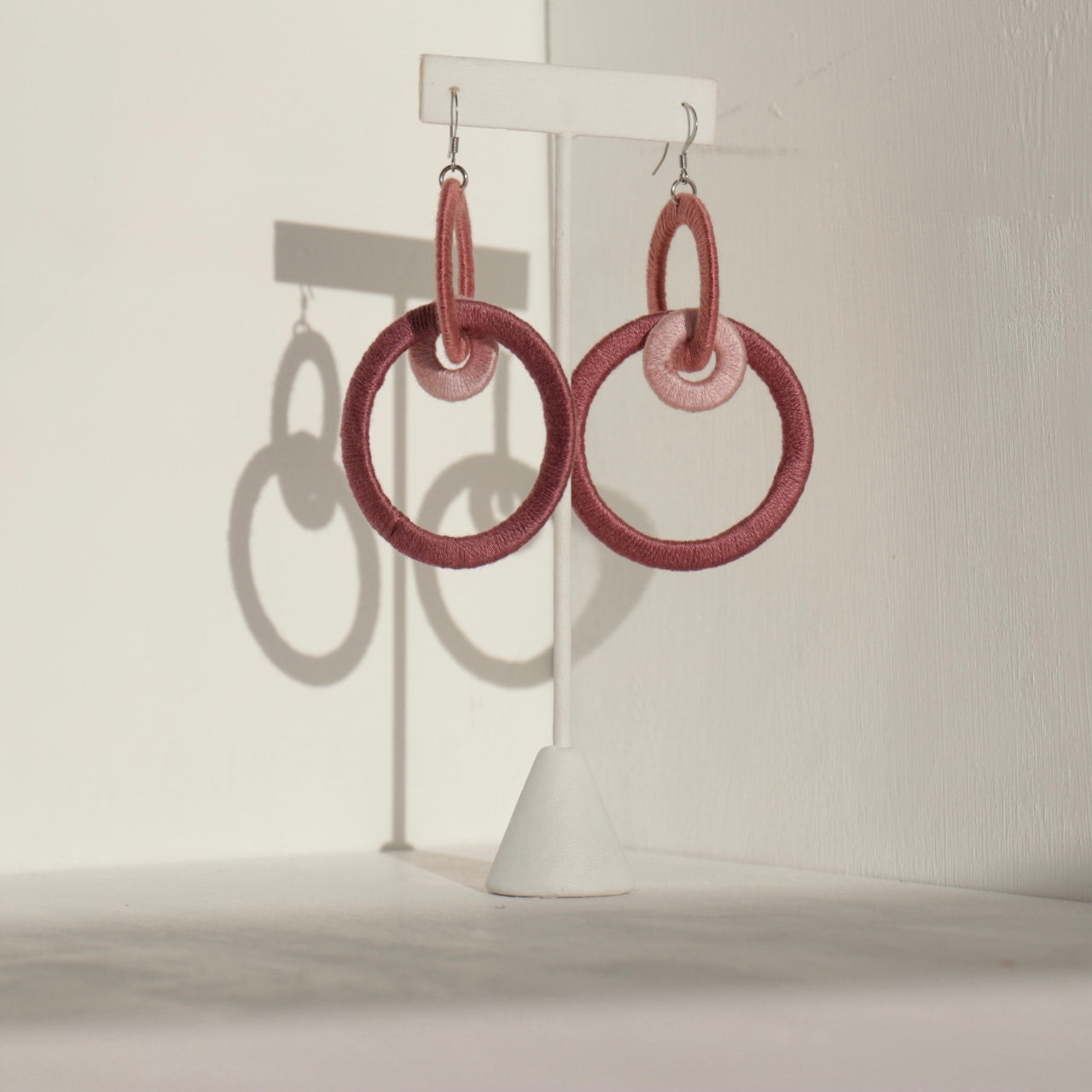 Close-up of the Jodee Statement Earrings, featuring interlocking loops that move with intention. A handcrafted piece designed in Houston for effortless expression.
