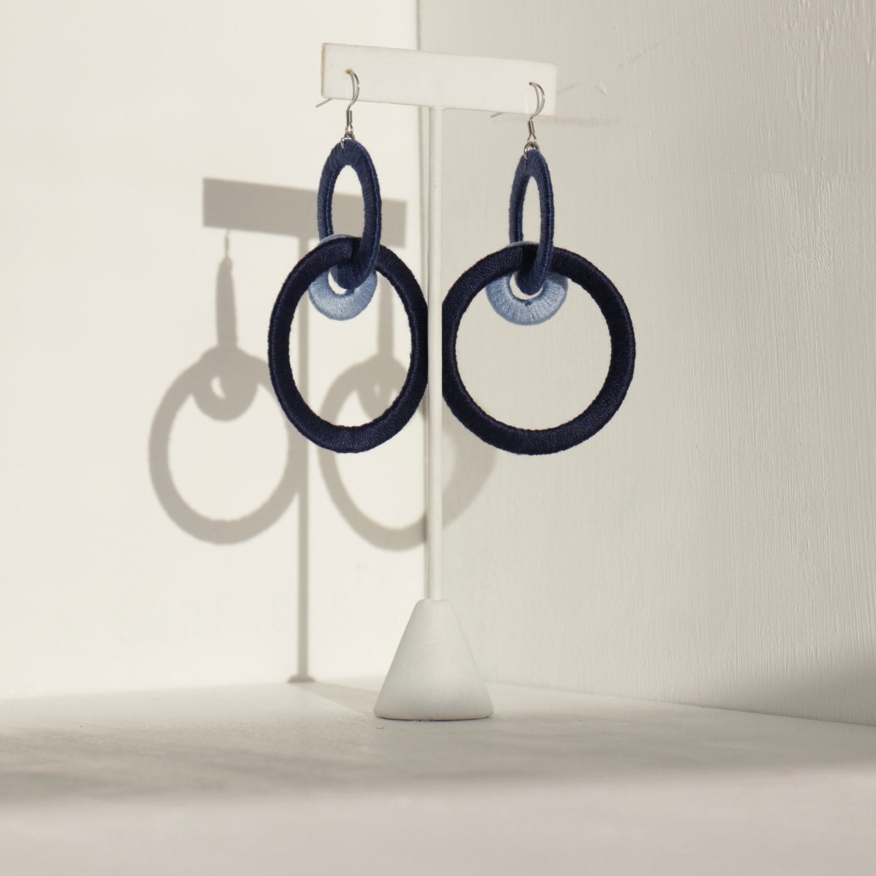 Close-up of the Jodee Statement Earrings, featuring interlocking loops that move with intention. A handcrafted piece designed in Houston for effortless expression.