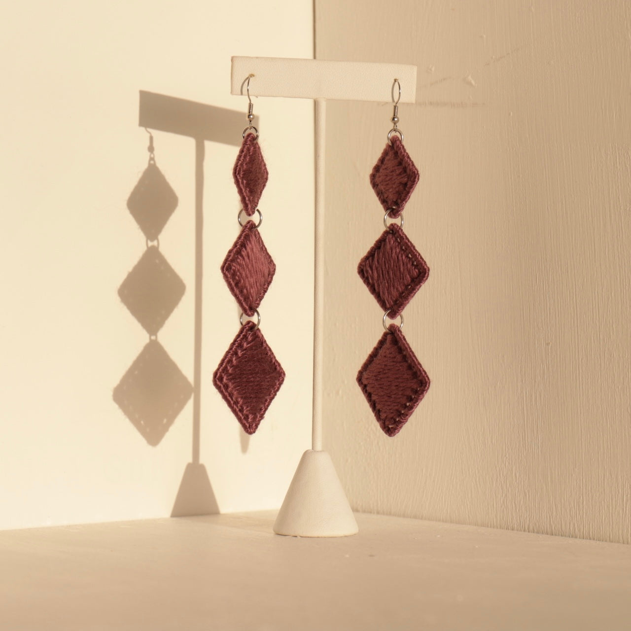 Mauve Kambi earrings by OlaNti Houston, embodying soft elegance with a handcrafted, sculptural touch