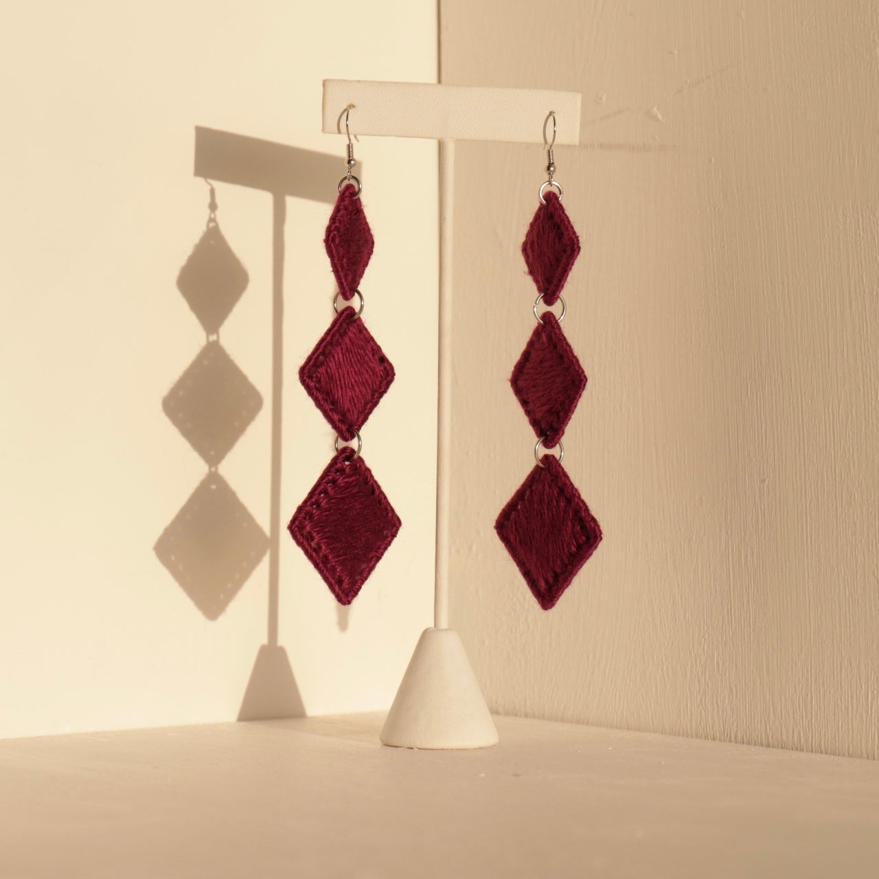Maroon Kambi earrings, created with a layered diamond formation that catches light and movement beautifully