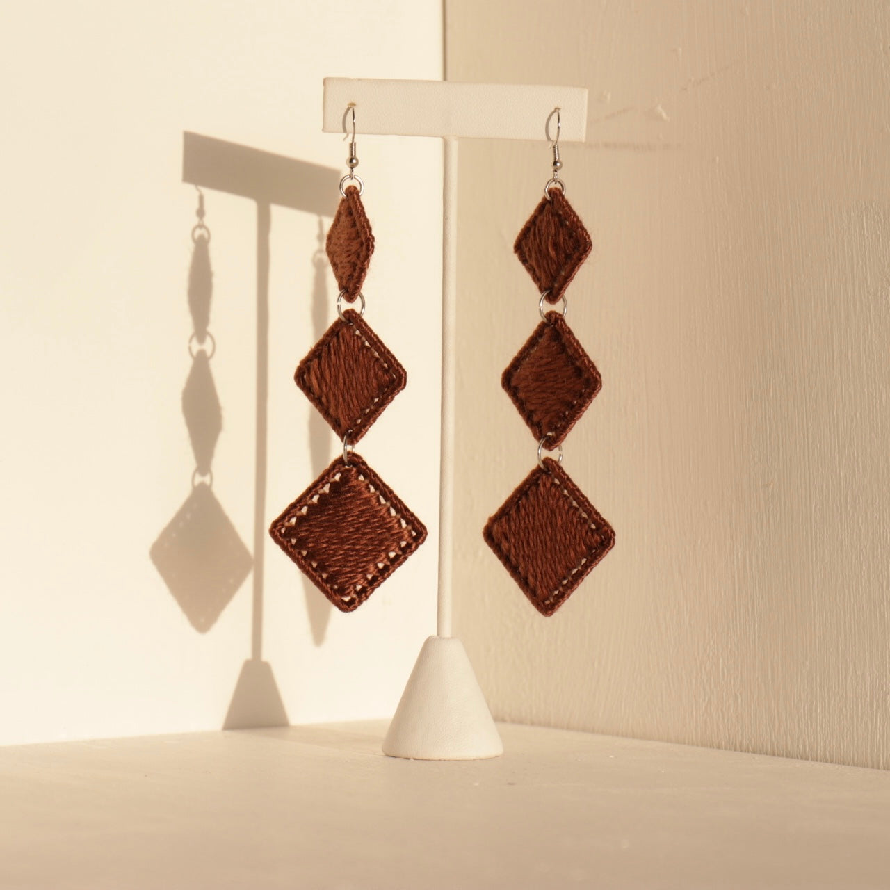 Dark brown Kambi earrings, handcrafted with sculptural precision for a contemporary, artistic edge
