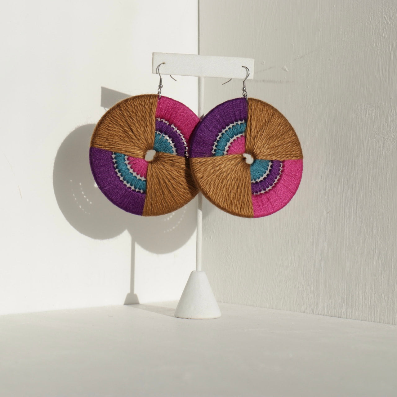 Daryl statement earrings by OlaNti, handcrafted with vibrant geometric design. Made in Houston