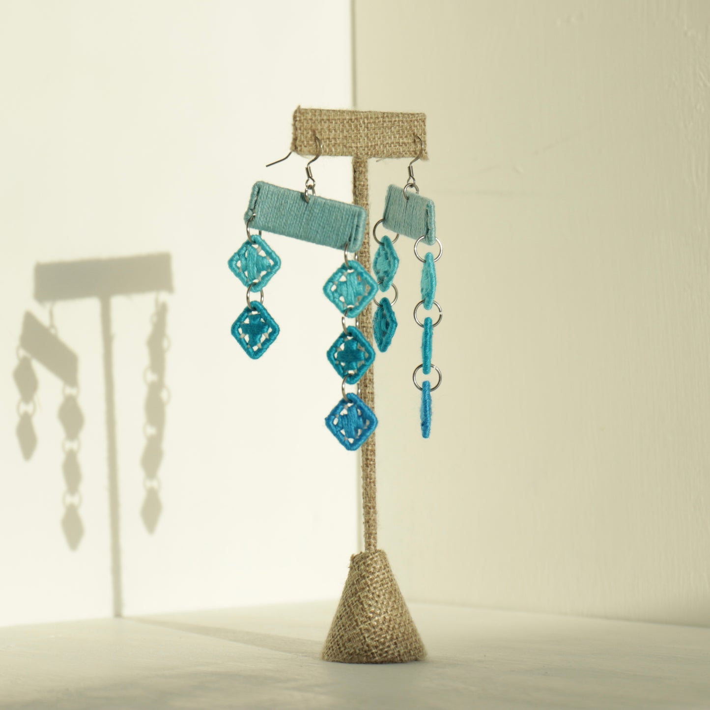 The Finesse earrings in blue by OlaNti, handcrafted in Houston for movement and presence