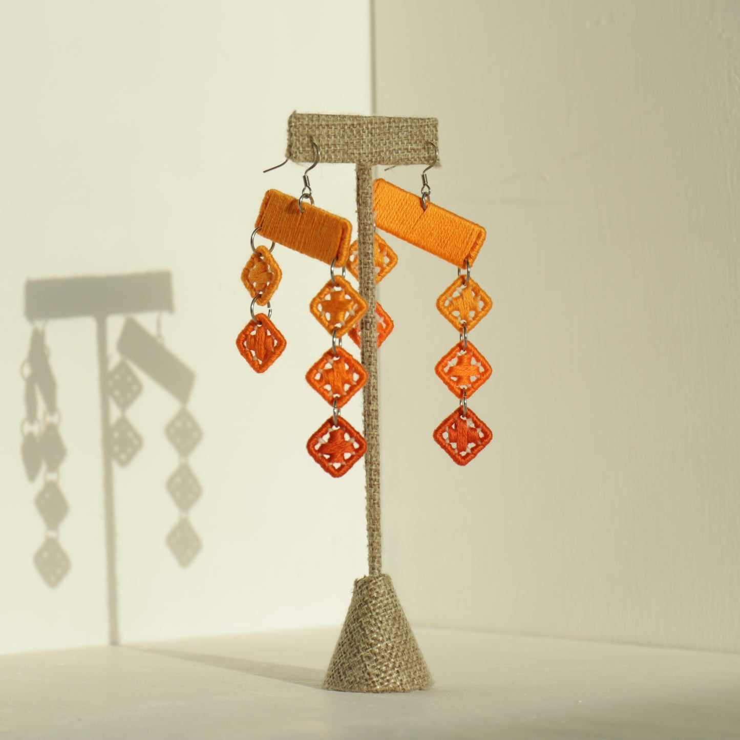 The Finesse earrings in orange by OlaNti, geometric elegance with an effortless rhythm
