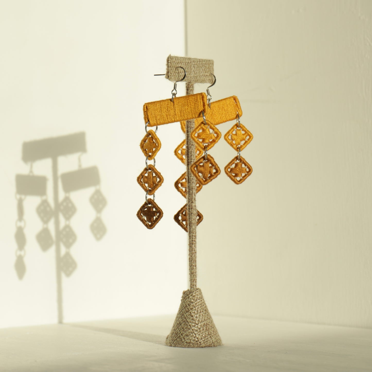 The Finesse earrings in yellow by OlaNti, bringing color, form, and movement together in one statement piece