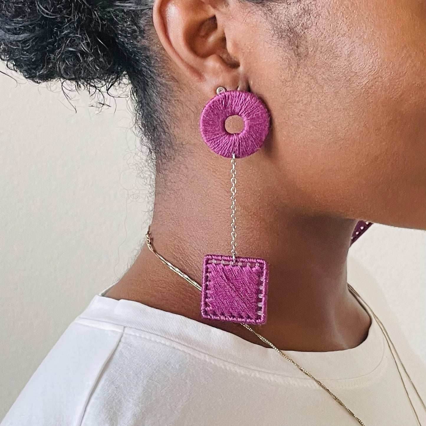 The Klowii earrings in deep purple by OlaNti Houston, balancing boldness and minimalism