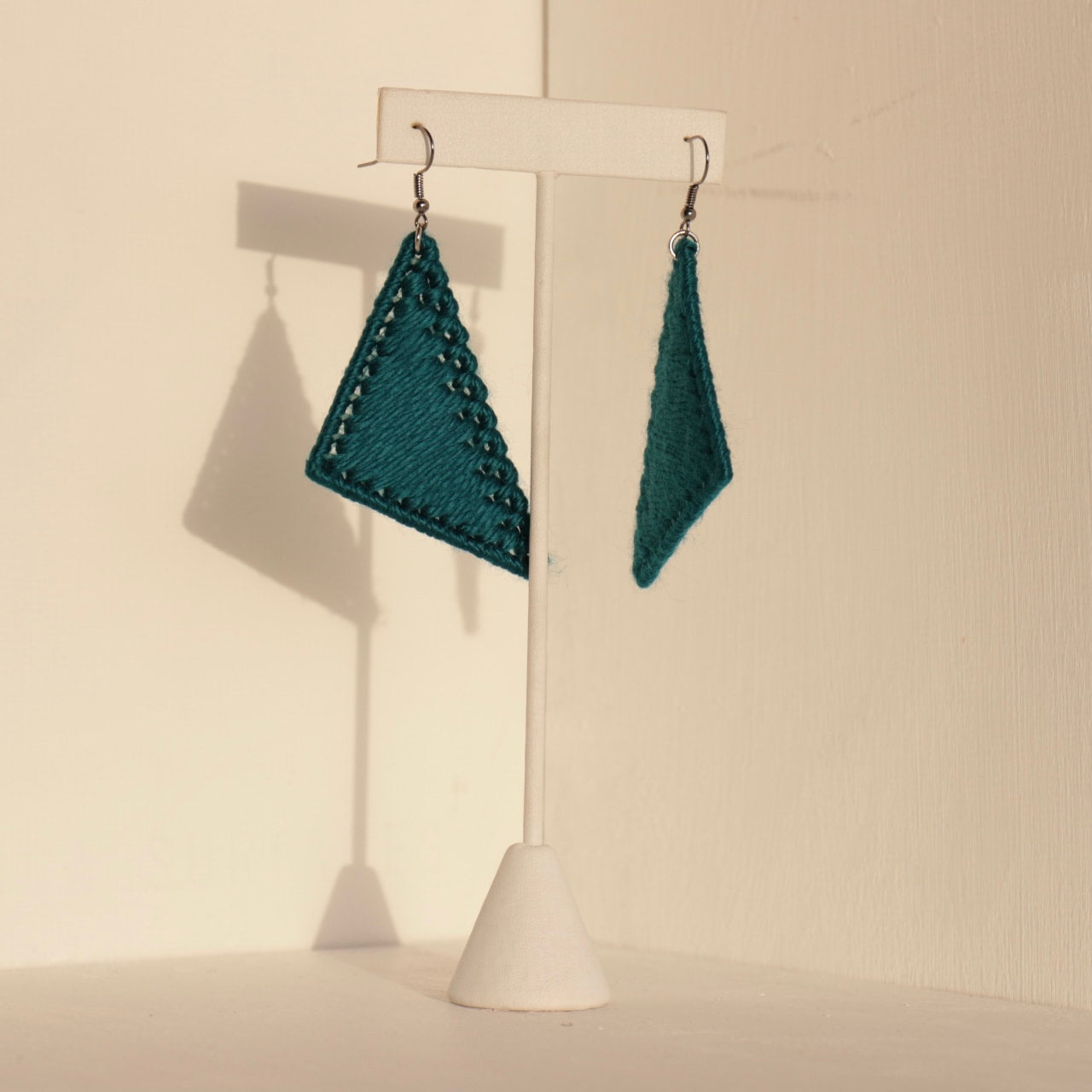 The Kofi earrings in teal by OlaNti Houston, a fresh take on geometric jewelry