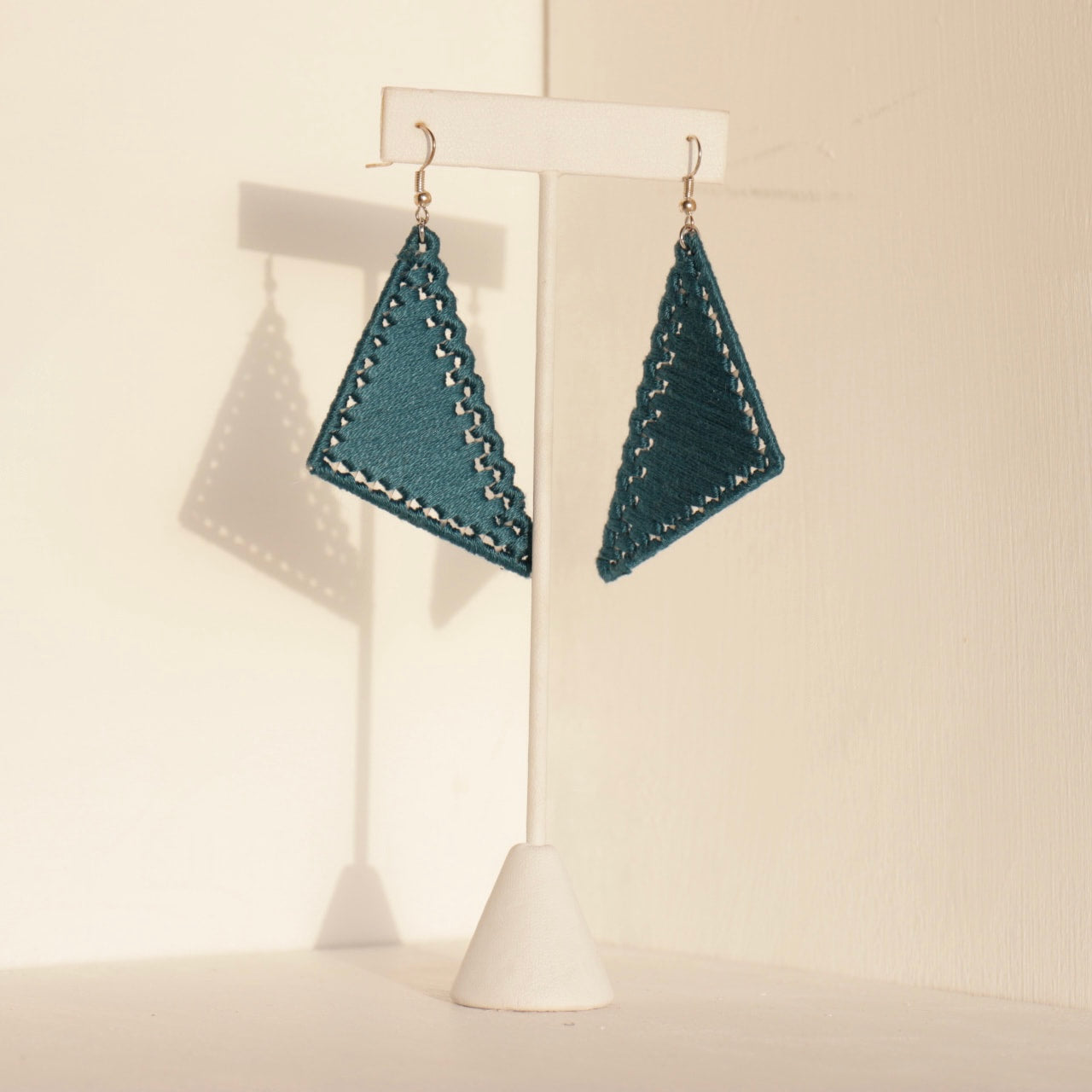 The Kofi earrings in teal by OlaNti Houston, a fresh take on geometric jewelry
