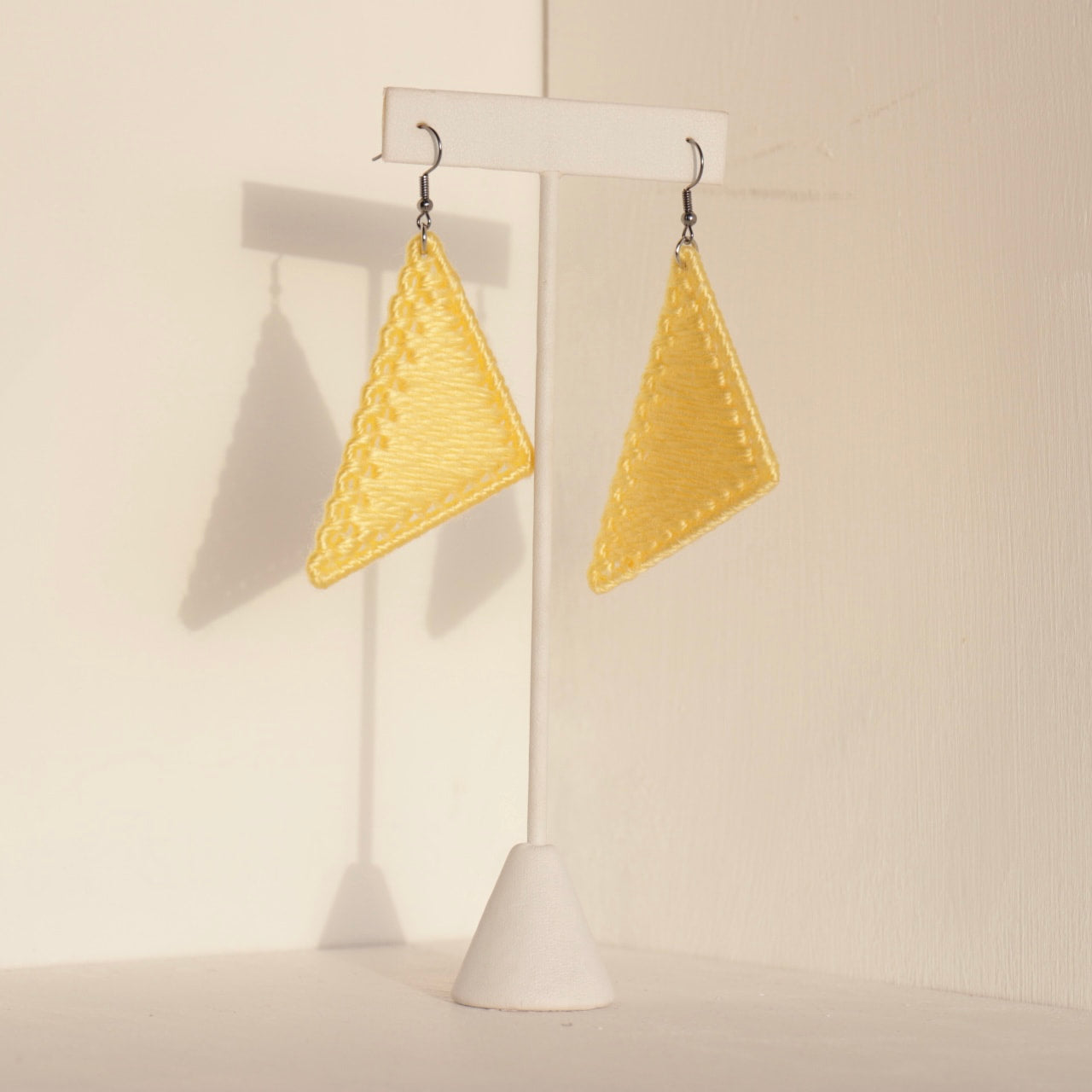 The Kofi earrings in yellow by OlaNti Houston, vibrant and structured