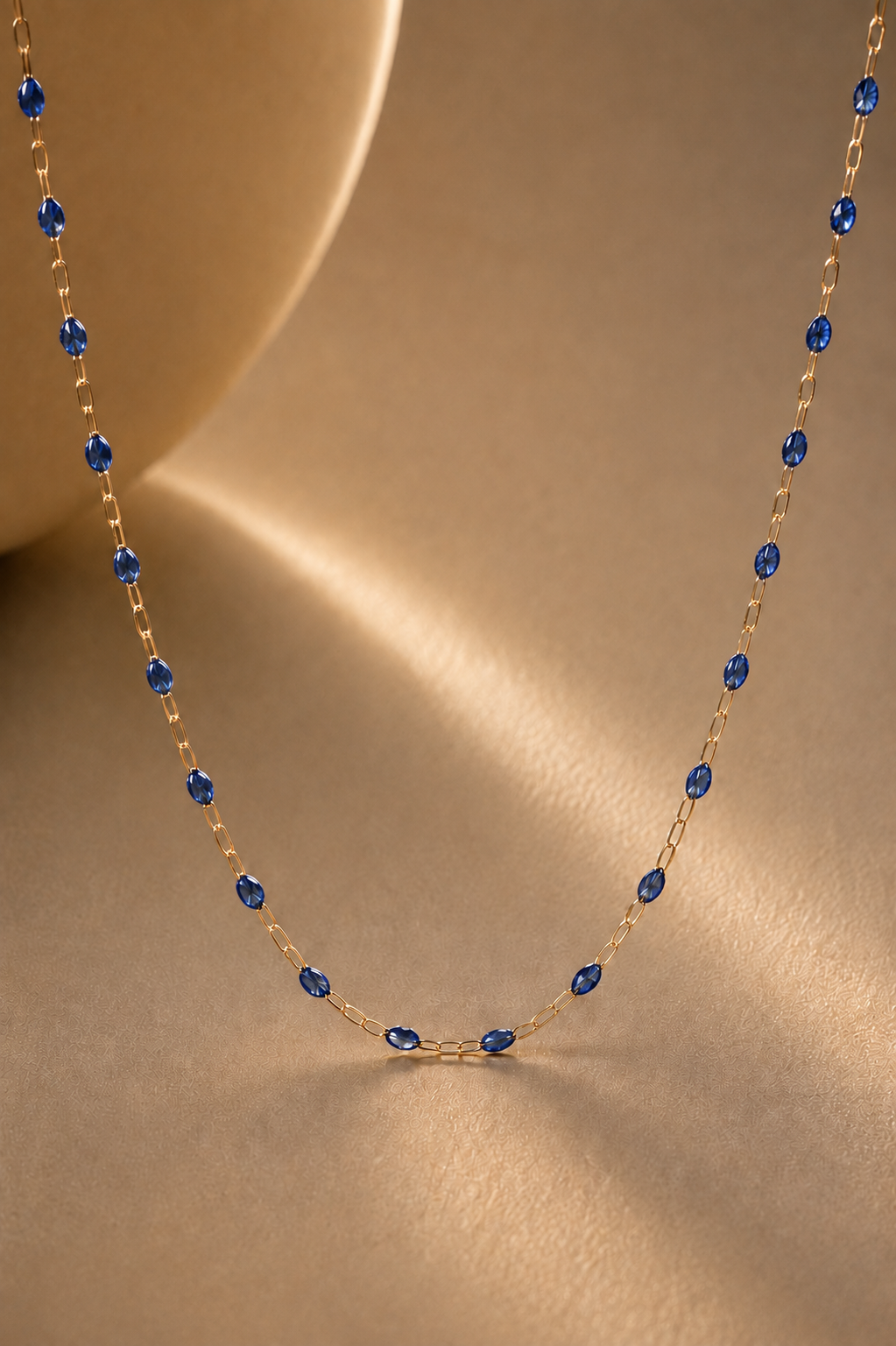 Gold chain necklace with bluee namel detail