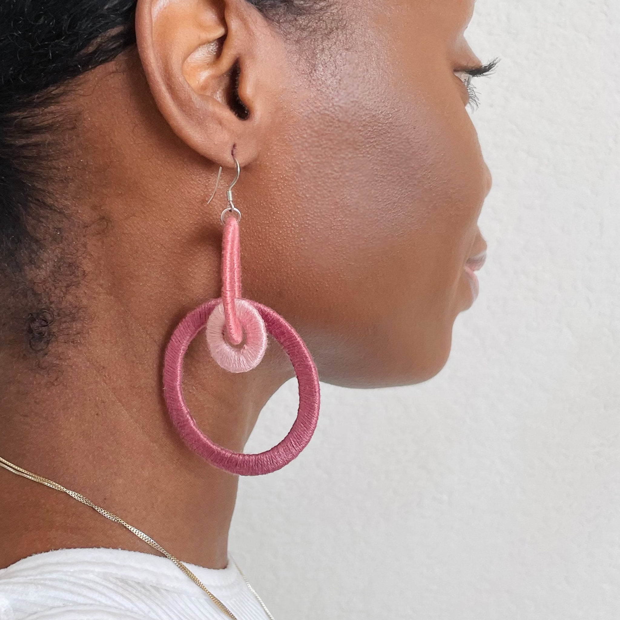 Close-up of the Jodee Statement Earrings, featuring interlocking loops that move with intention. A handcrafted piece designed in Houston for effortless expression.