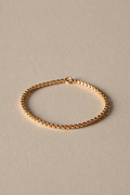 Gold Chain Ring on a beige background