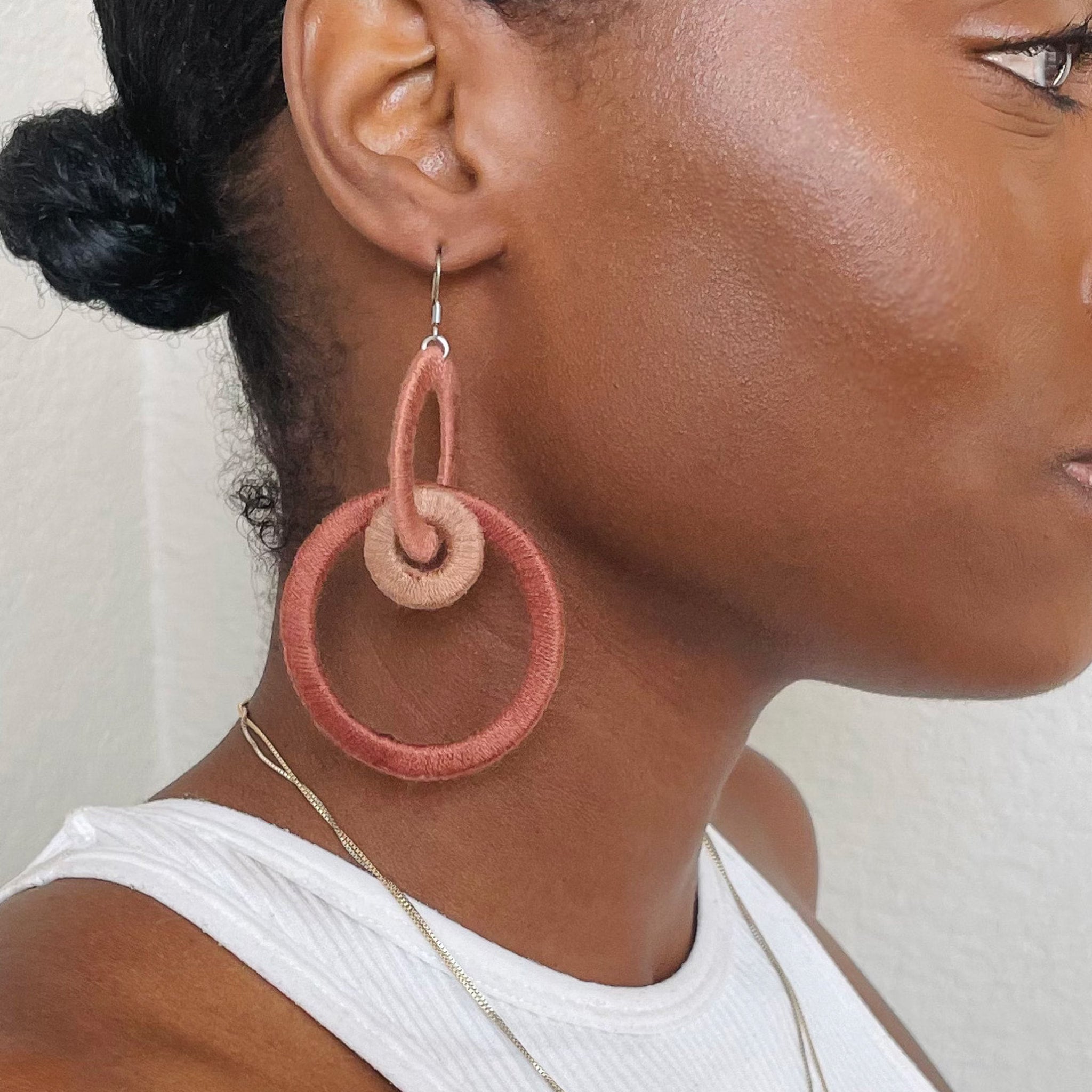 Close-up of the Jodee Statement Earrings, featuring interlocking loops that move with intention. A handcrafted piece designed in Houston for effortless expression.