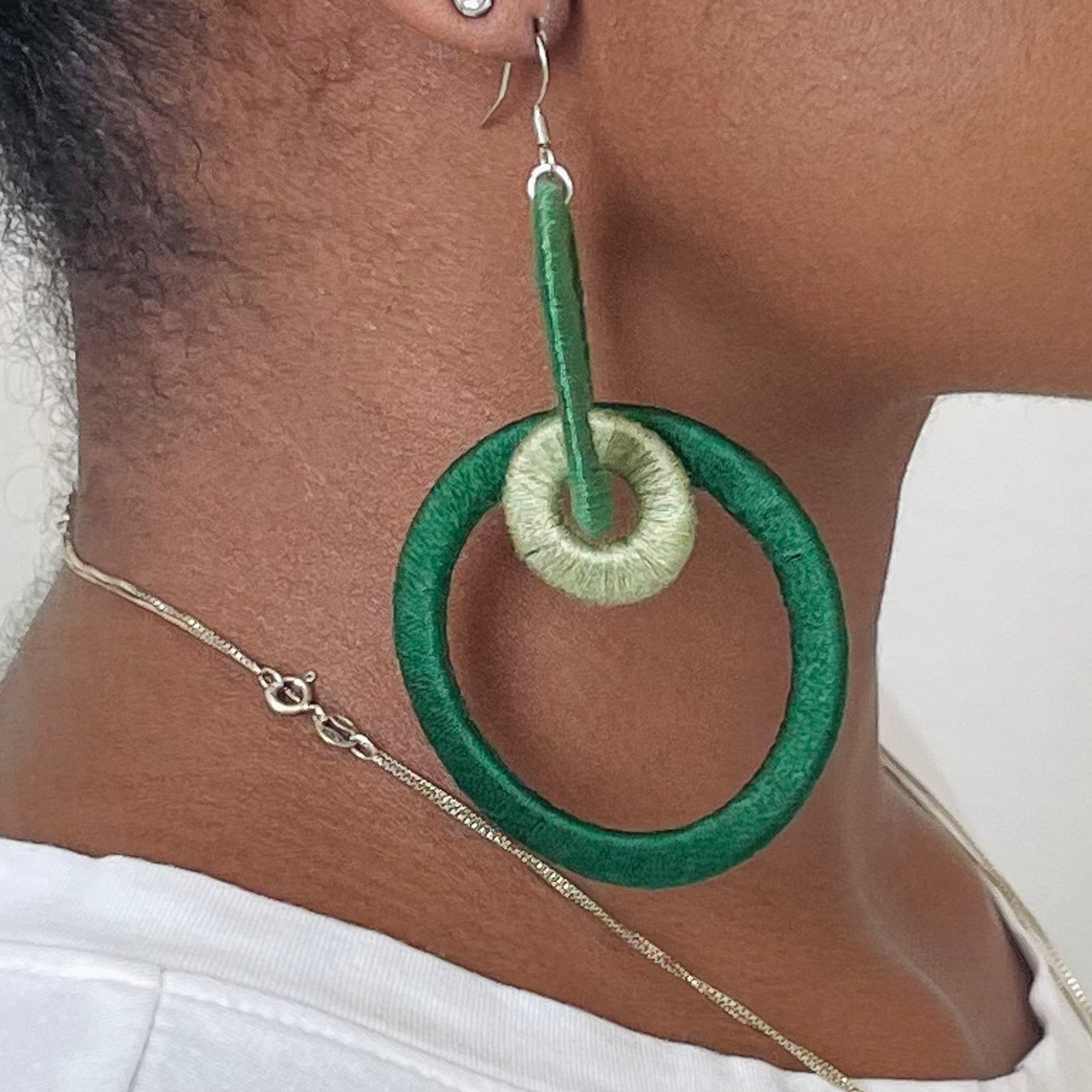 Close-up of the Jodee Statement Earrings, featuring interlocking loops that move with intention. A handcrafted piece designed in Houston for effortless expression.