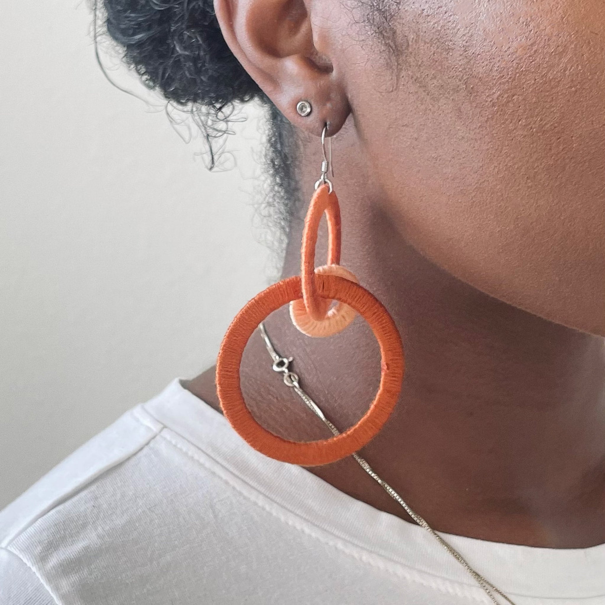 Close-up of the Jodee Statement Earrings, featuring interlocking loops that move with intention. A handcrafted piece designed in Houston for effortless expression.