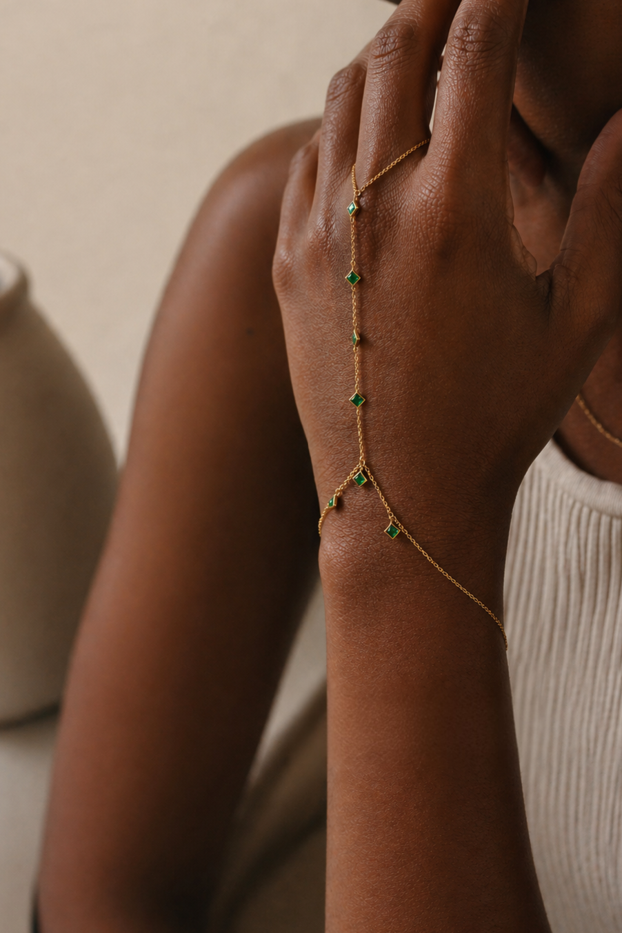 Woman wearing a gold hand chain