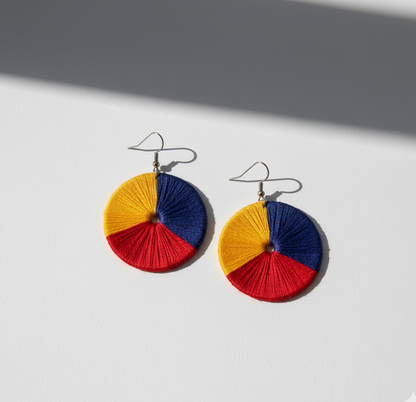 Colorful circular earrings on a white background
