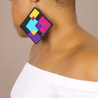 Handmade statement earrings with a bold, abstract design, crafted with needle art and rich color blocking