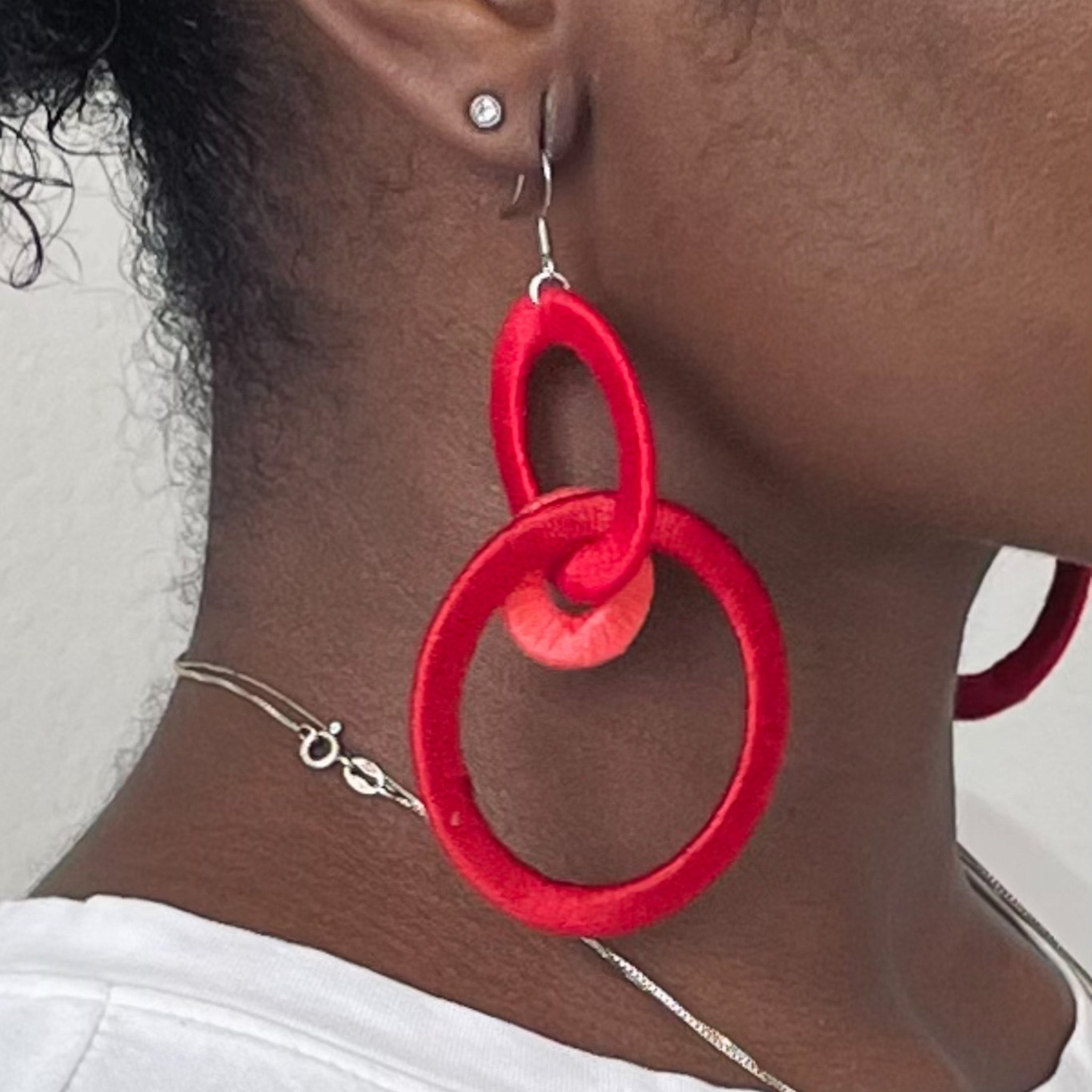 Close-up of the Jodee Statement Earrings, featuring interlocking loops that move with intention. A handcrafted piece designed in Houston for effortless expression.