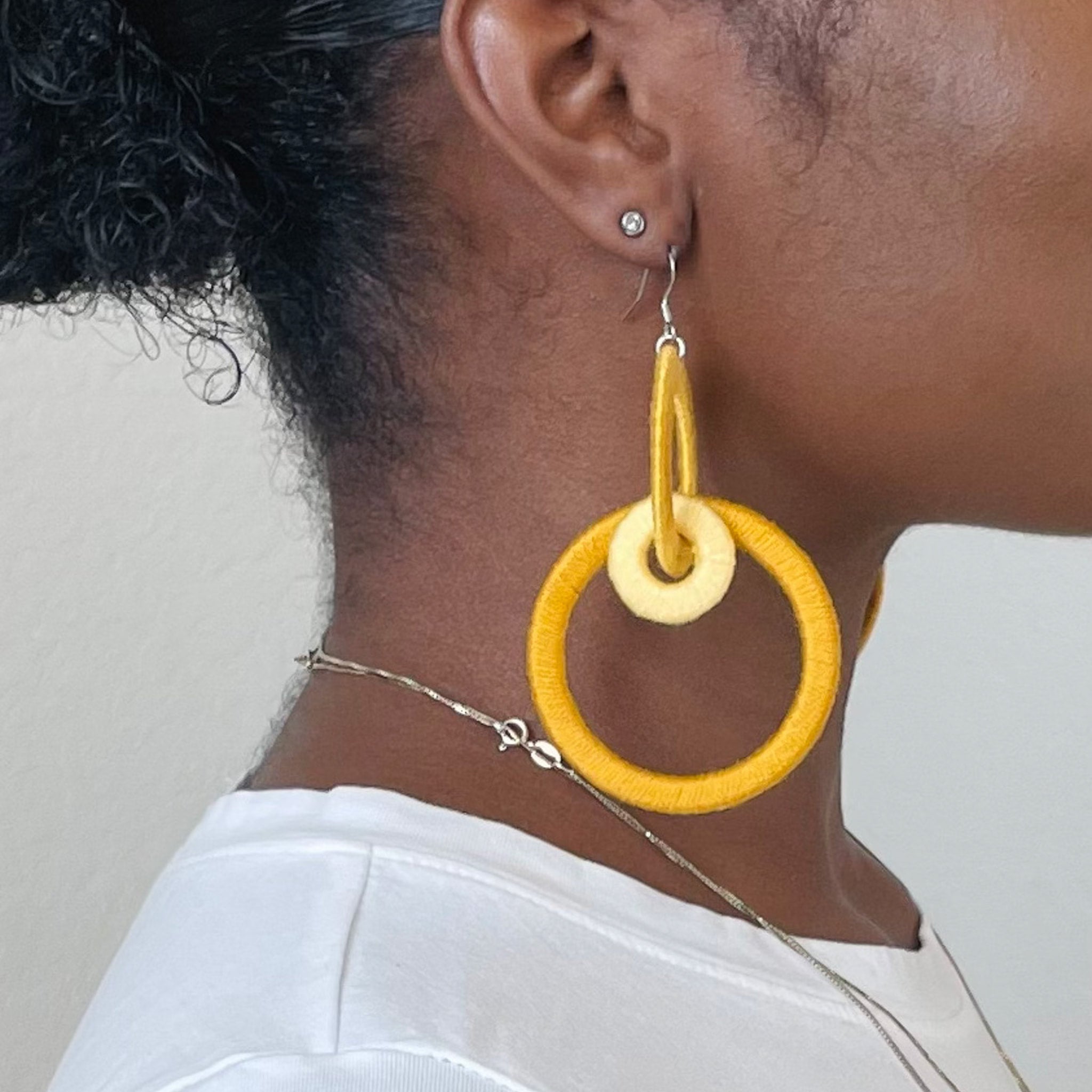 Close-up of the Jodee Statement Earrings, featuring interlocking loops that move with intention. A handcrafted piece designed in Houston for effortless expression.