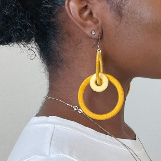 Close-up of the Jodee Statement Earrings, featuring interlocking loops that move with intention. A handcrafted piece designed in Houston for effortless expression.