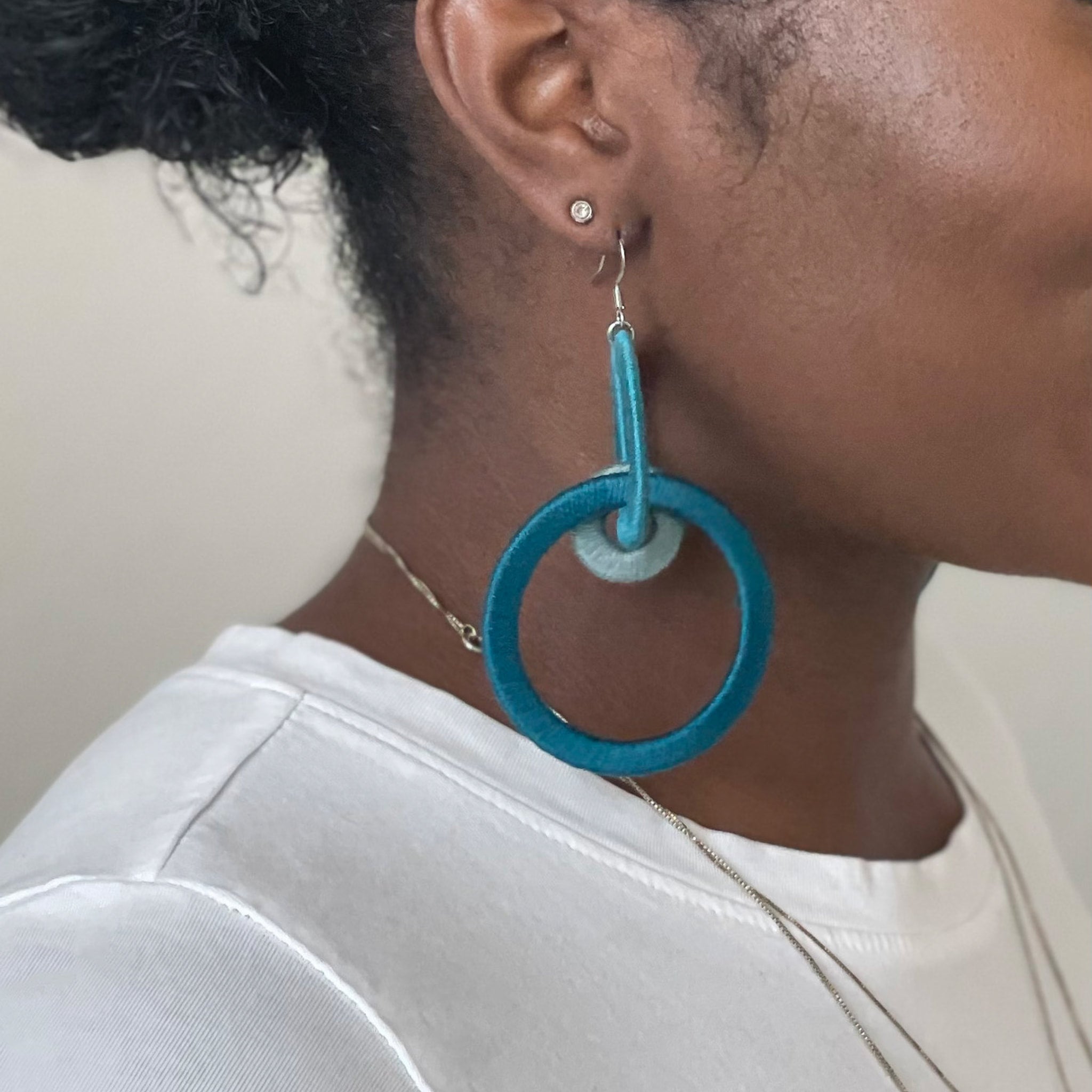 Close-up of the Jodee Statement Earrings, featuring interlocking loops that move with intention. A handcrafted piece designed in Houston for effortless expression.