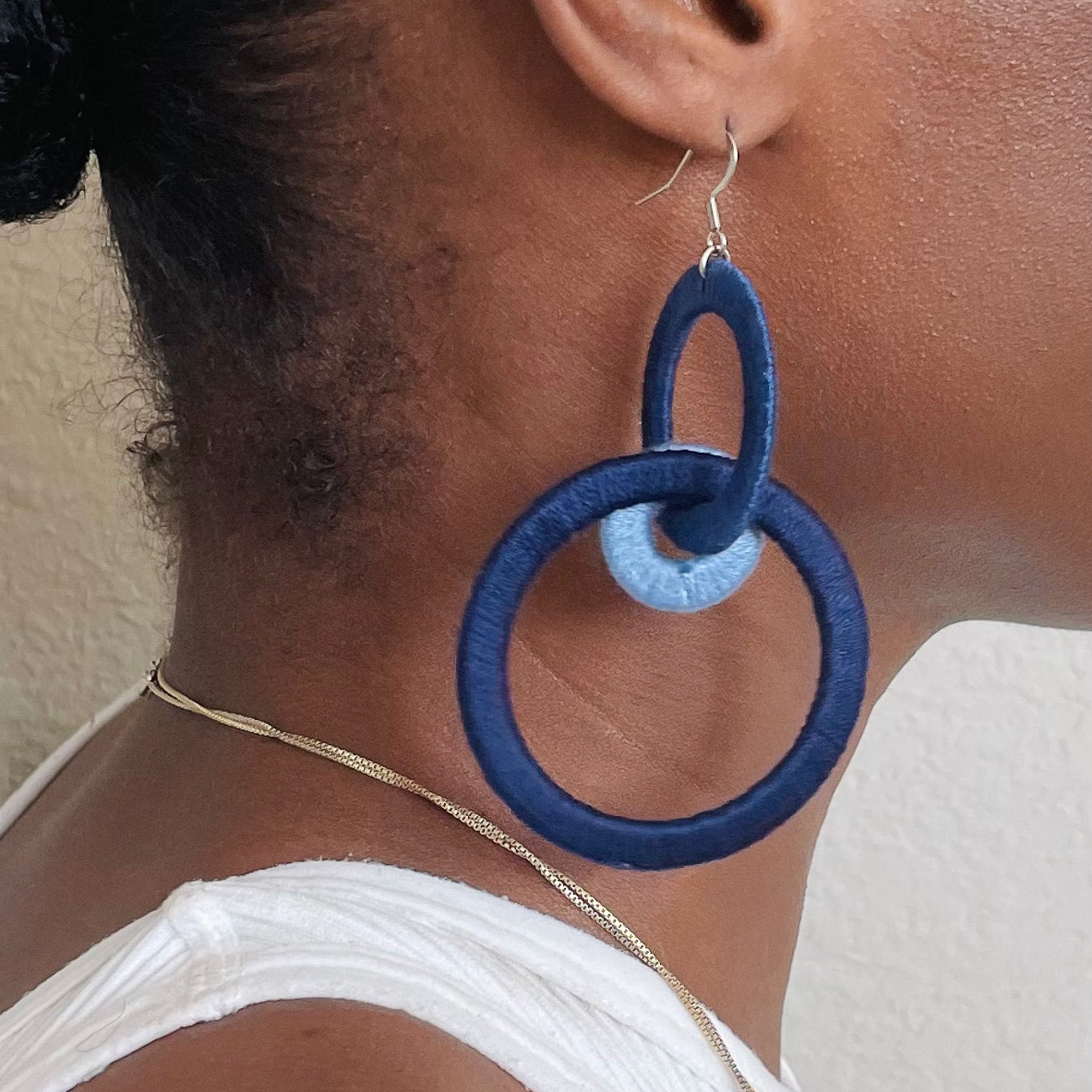 Close-up of the Jodee Statement Earrings, featuring interlocking loops that move with intention. A handcrafted piece designed in Houston for effortless expression.
