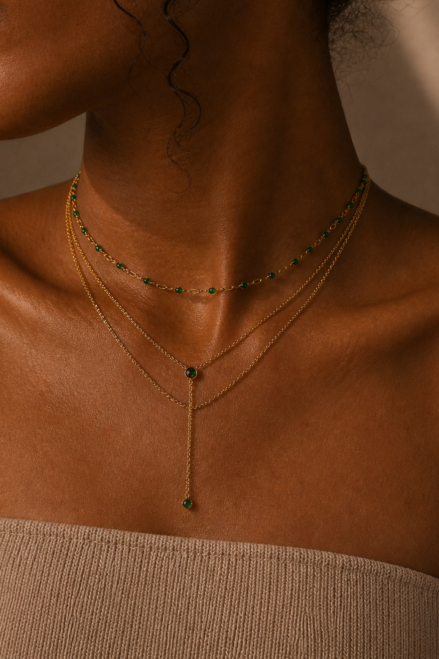 Woman wearing multiple gold necklaces