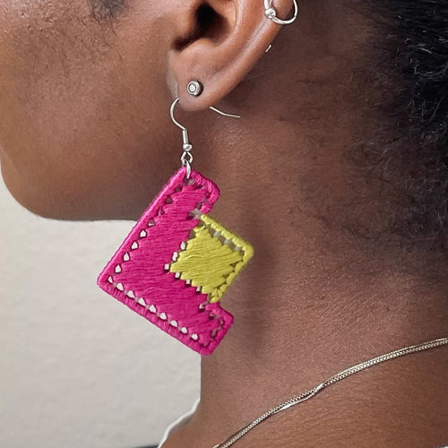 Model wearing The Baroq earrings, blending artistic craftsmanship with a contemporary feel.