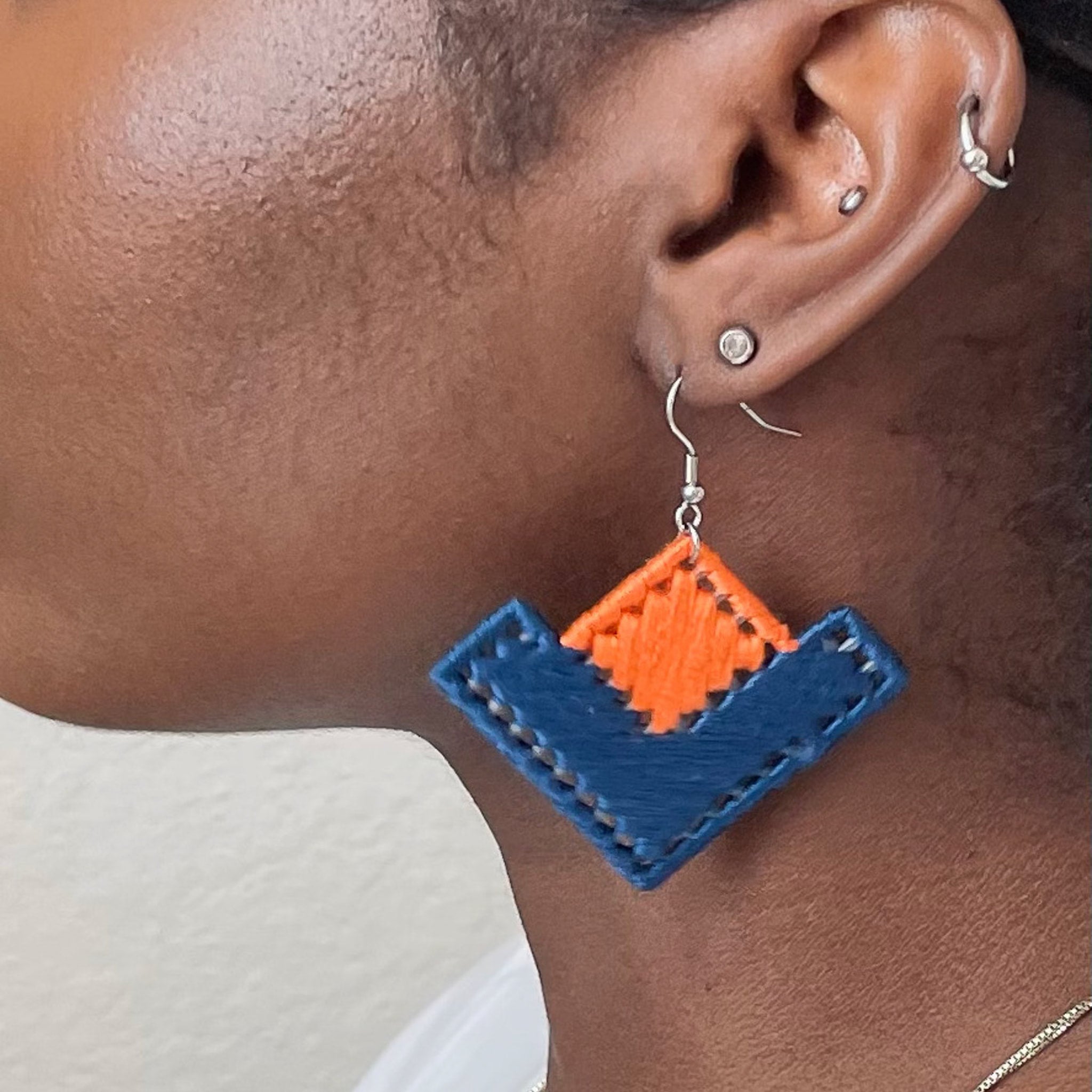 Model wearing The Baroq earrings, blending artistic craftsmanship with a contemporary feel.