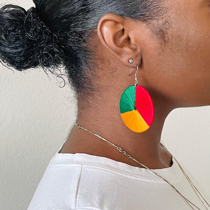 Model wearing The Bode earrings in a side profile, showcasing the colorblock design