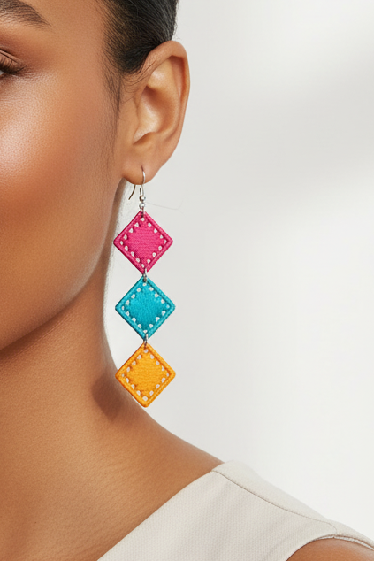 Woman wearing colorful earrings on a white background