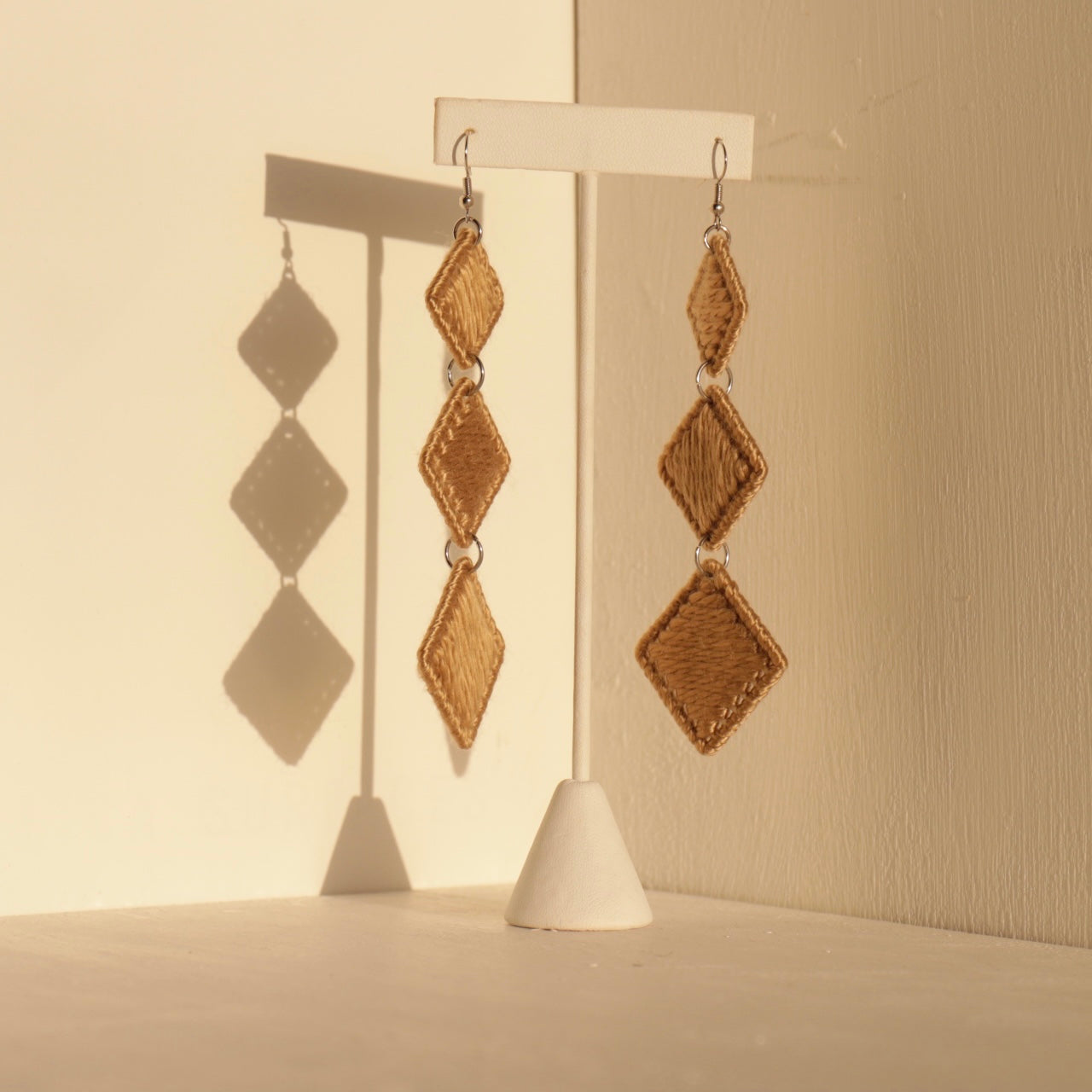 Brown Kambi earrings by OlaNti Houston, designed with structured layers for a bold yet refined statement