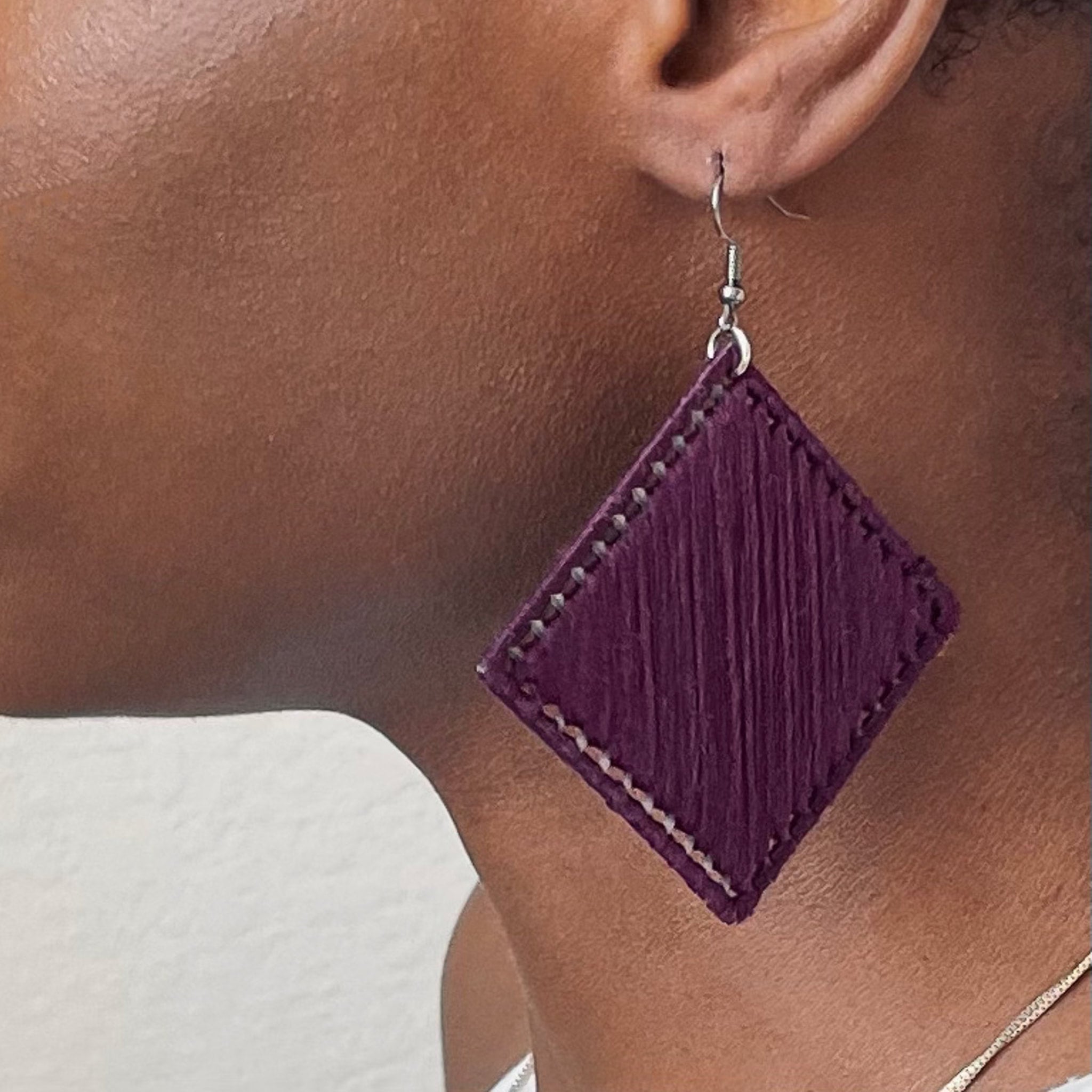 The Kwame earrings in rich purple, designed for a refined and artistic touch