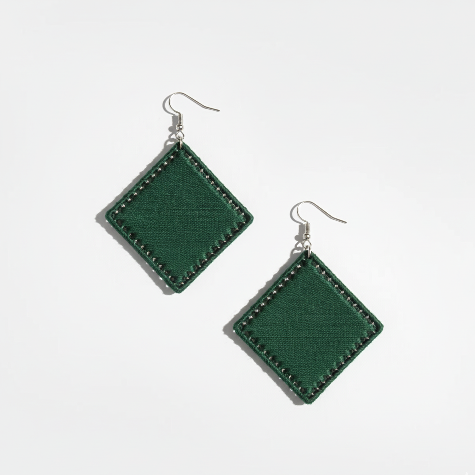 Green square earrings on a white background