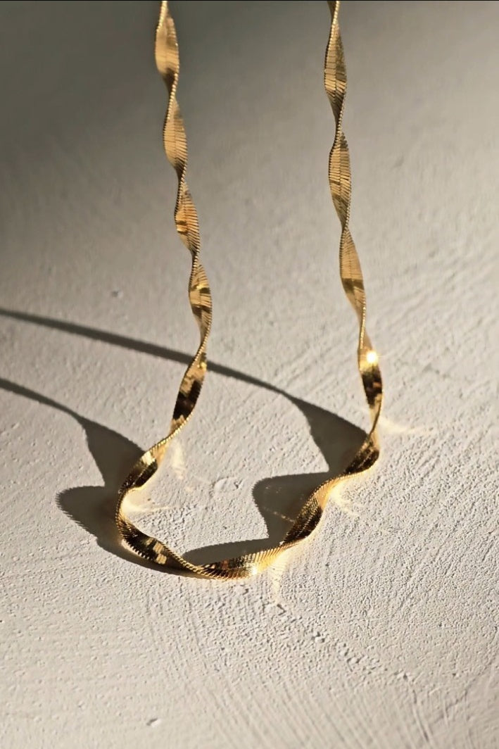 14K gold Amara chain photographed in warm directional light