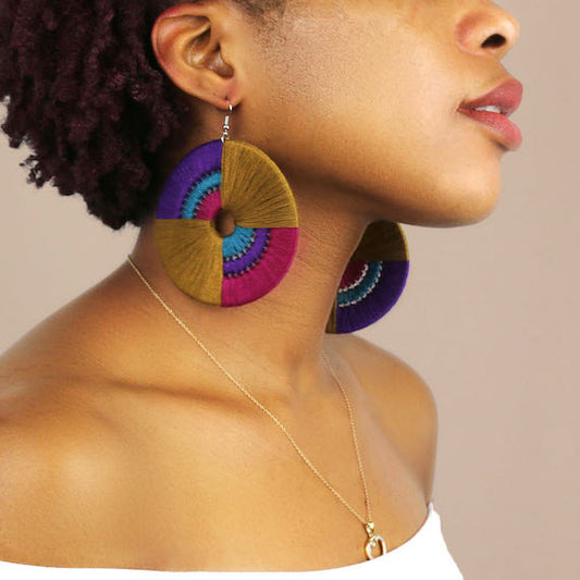 Daryl statement earrings by OlaNti, handcrafted with vibrant geometric design. Made in Houston