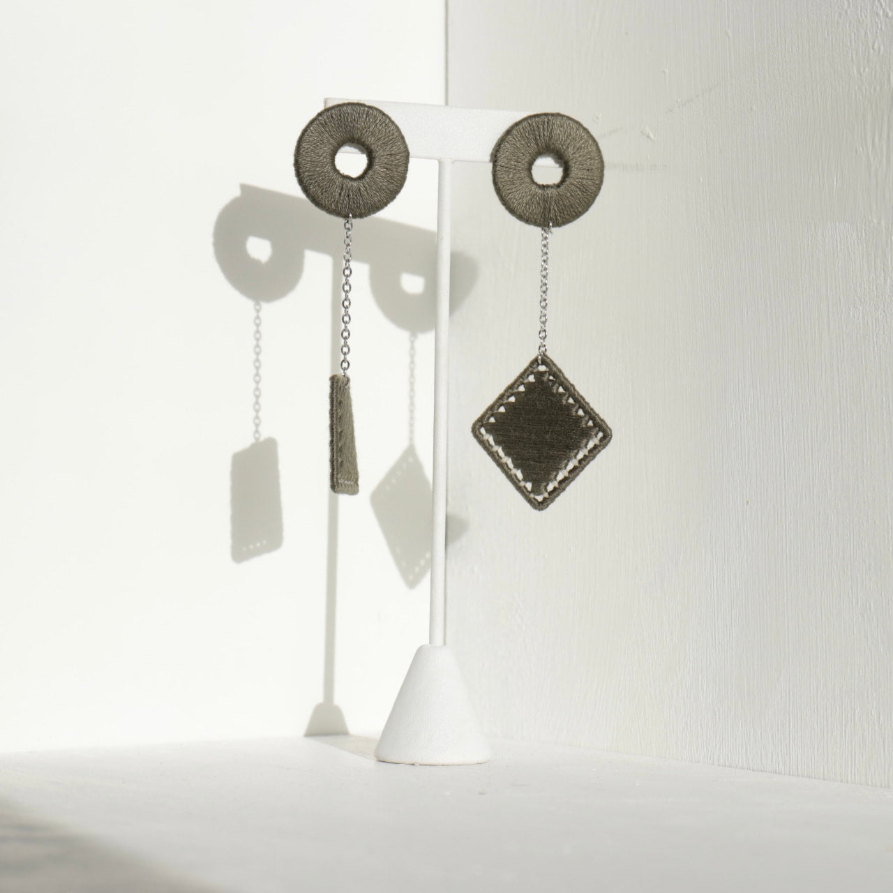 The Klowii earrings in muted olive by OlaNti Houston, a contemporary and versatile design
