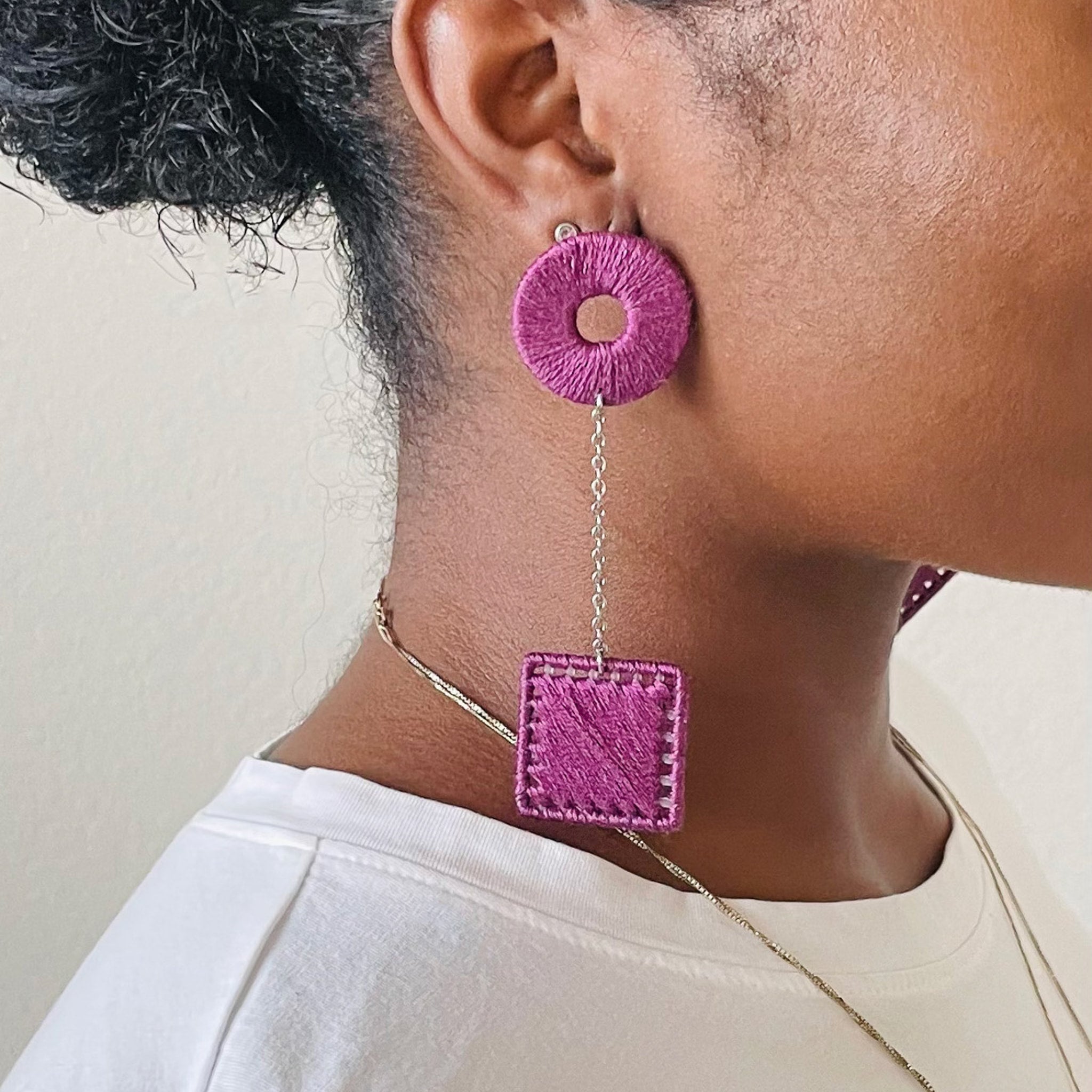 The Klowii earrings in deep purple by OlaNti Houston, balancing boldness and minimalism