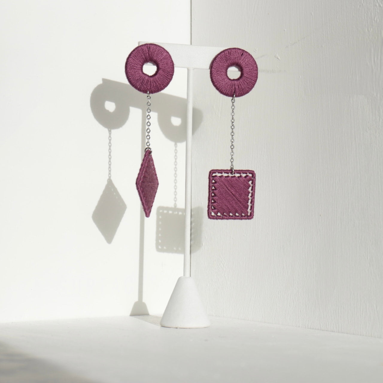 The Klowii earrings in deep purple by OlaNti Houston, balancing boldness and minimalism