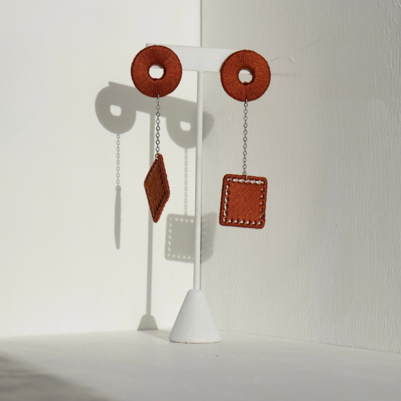 The Klowii earrings in warm brown by OlaNti Houston, grounding and sophisticated